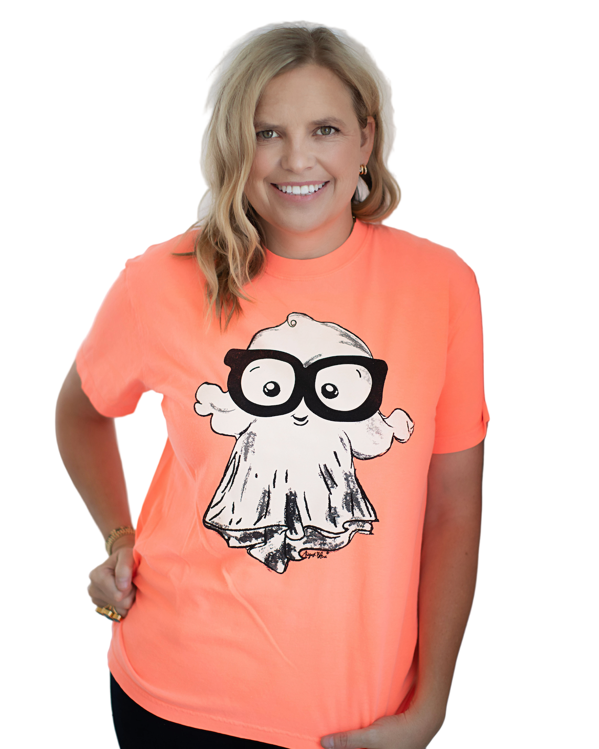 Woman wearing a bright orange t-shirt with a graphic of a ghost wearing glasses on a white background