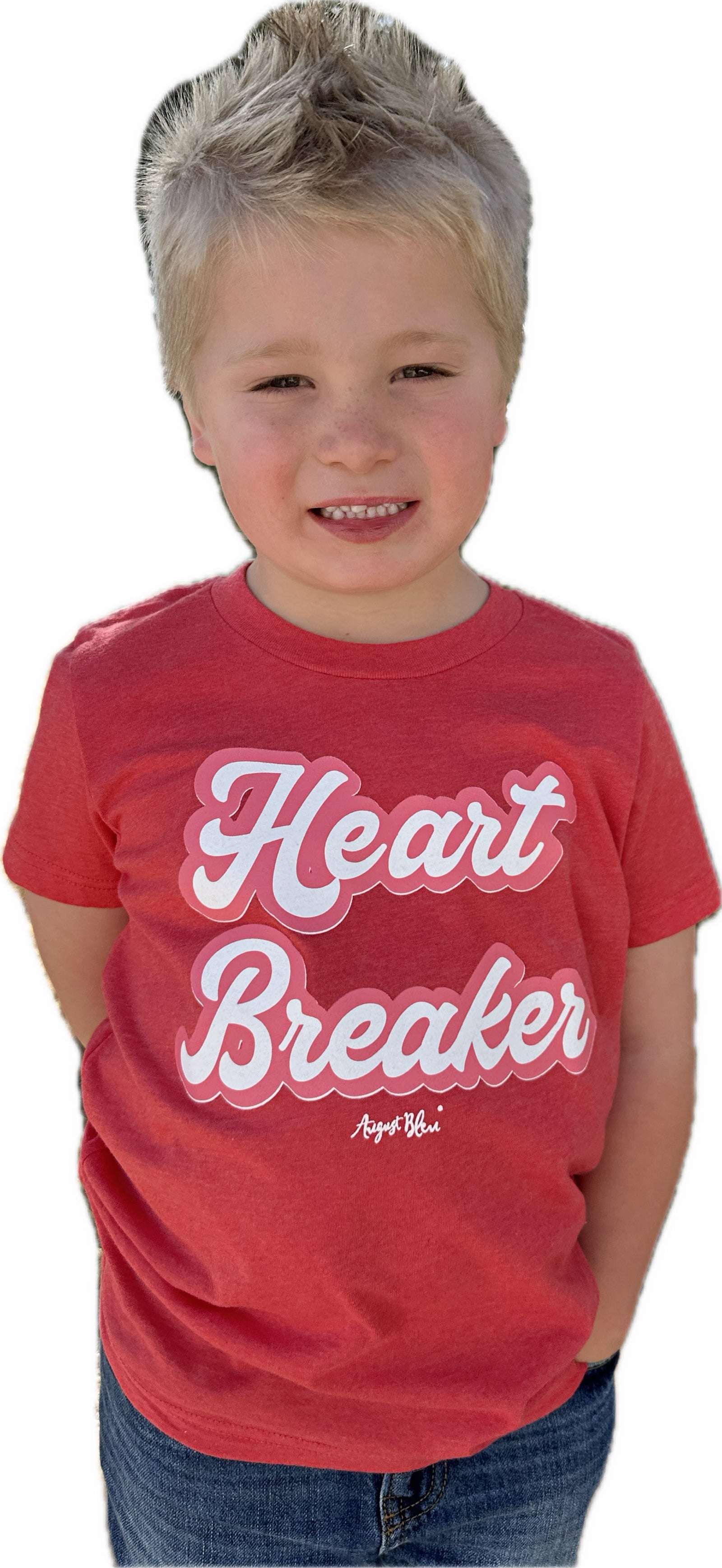 Child wearing a red 'Heart Breaker' t-shirt on a white background