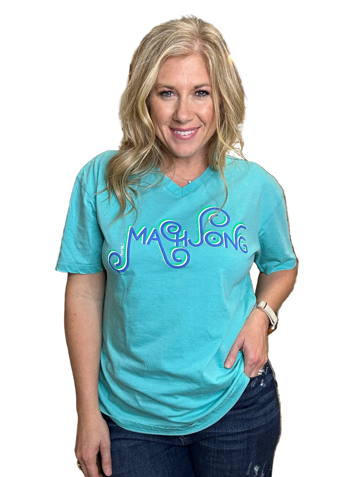 Person wearing a blue t-shirt with 'Make Love' text, standing in front of wooden cabinets.