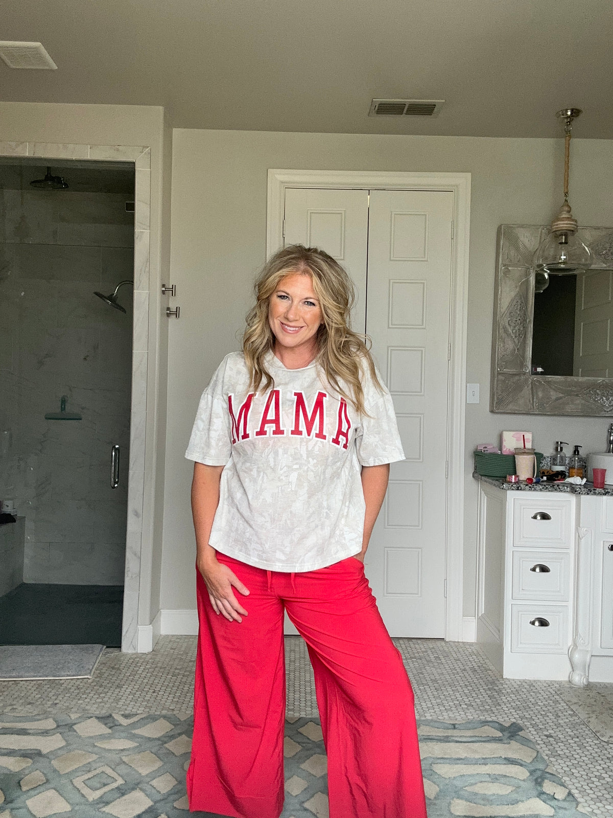 mama camo graphic with red wide leg pants