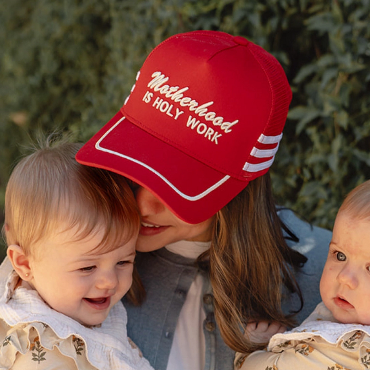 Motherhood Is Holy Work Trucker Cap.