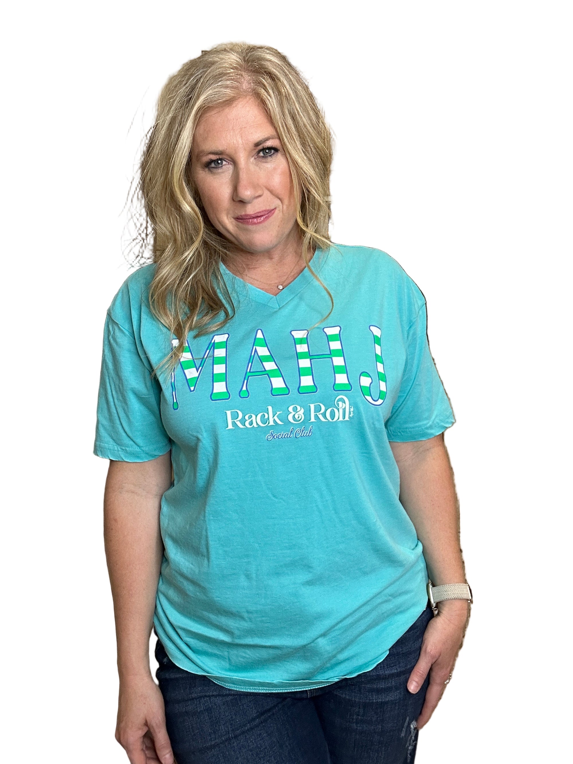 Woman wearing a blue t-shirt with text, lying on a wooden surface.